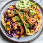 Spicy Shrimp Tacos with Mango Slaw and Avocado Crema